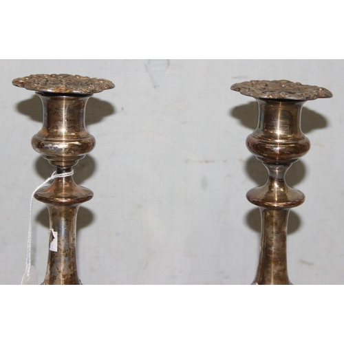 1008 - A pair of antique silver plated candlesticks, seemingly unmarked, each approx 24cm tall