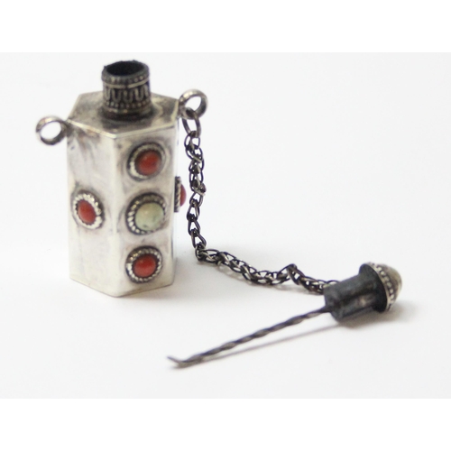 1012 - A Tibetan silver snuff bottle, seemingly unmarked but XRF tests approx 92% silver, inlaid with white... 