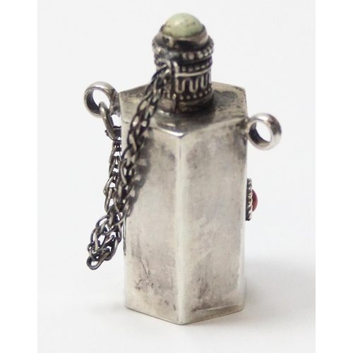 1012 - A Tibetan silver snuff bottle, seemingly unmarked but XRF tests approx 92% silver, inlaid with white... 