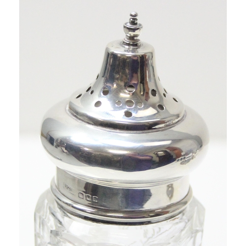 1019 - A large silver topped and cut glass sugar castor or muffineer, London 1928 by Henry Hobson & Son, ap... 