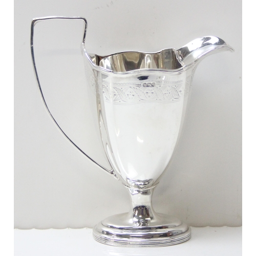 1030 - An antique silver milk or cream jug with engraved decoration, Sheffield 1923 by Mappin & Webb, appro... 