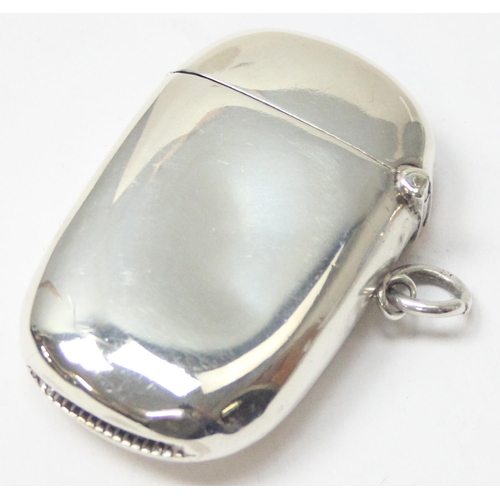 1039 - An antique silver vesta case of plain oval form, with engraved initials, Birmingham 1897 by Joseph G... 