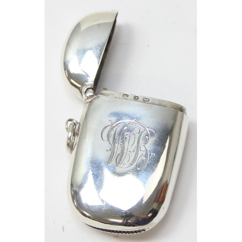 1039 - An antique silver vesta case of plain oval form, with engraved initials, Birmingham 1897 by Joseph G... 