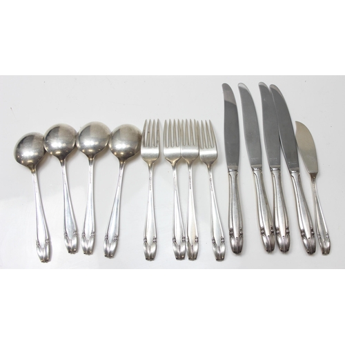 1053 - An American Sterling silver 4 place setting, spoon knife and fork and a butter knife by Wallace, the... 