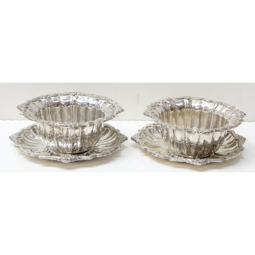 1074 - A pair of impressive heavy cast silver bowl and saucers, marked with Arabic hallmarks, likely of Emi... 