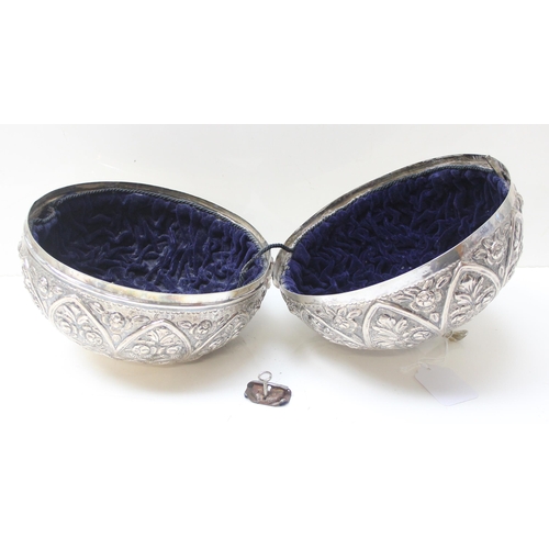 1078 - A large silver pumpkin shaped keepsake box, the exterior decorated with repousse flowers, the hinged... 