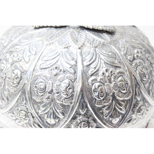 1078 - A large silver pumpkin shaped keepsake box, the exterior decorated with repousse flowers, the hinged... 