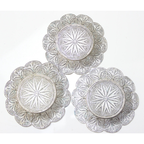 1079 - A highly decorative silver filigree serving tray, with 6 matching saucers and 6 cup holders, all see... 