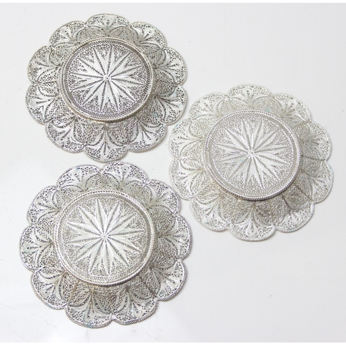 1079 - A highly decorative silver filigree serving tray, with 6 matching saucers and 6 cup holders, all see... 