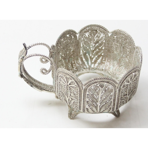 1079 - A highly decorative silver filigree serving tray, with 6 matching saucers and 6 cup holders, all see... 