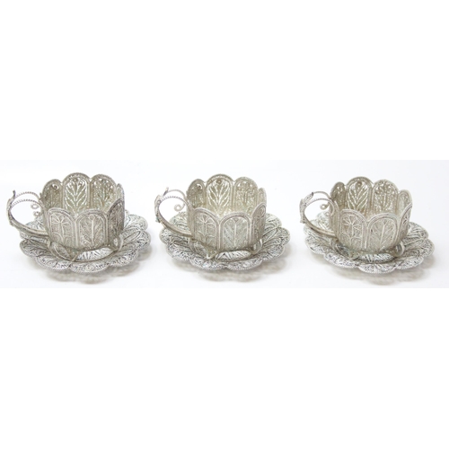 1079 - A highly decorative silver filigree serving tray, with 6 matching saucers and 6 cup holders, all see... 