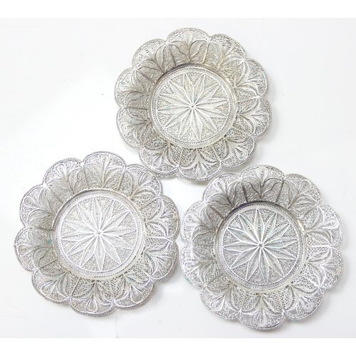 1079 - A highly decorative silver filigree serving tray, with 6 matching saucers and 6 cup holders, all see... 