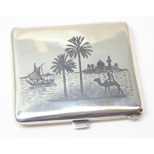 1090 - A fine Iraqi silver & niello cigarette case, each side decorated with scenes of boats and palm trees... 