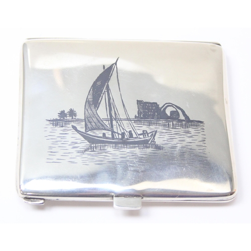 1090 - A fine Iraqi silver & niello cigarette case, each side decorated with scenes of boats and palm trees... 