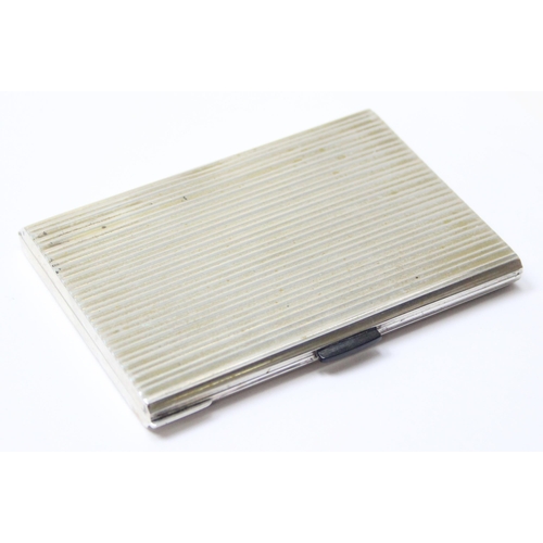 1091 - An Italian 800 silver cigarette case with striped decoration, dedication inside to Adnan Muzahim Ame... 