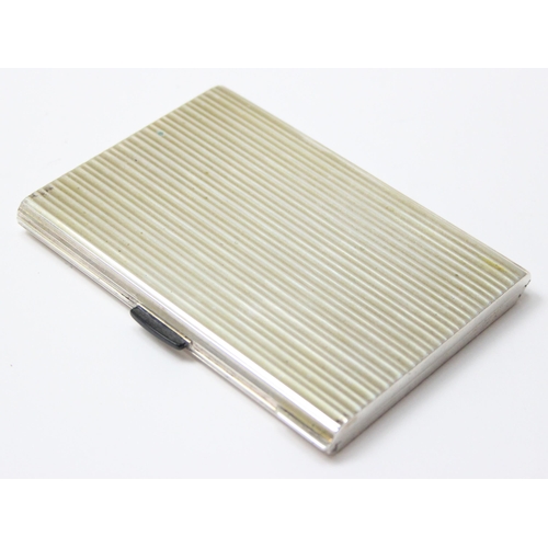 1091 - An Italian 800 silver cigarette case with striped decoration, dedication inside to Adnan Muzahim Ame... 