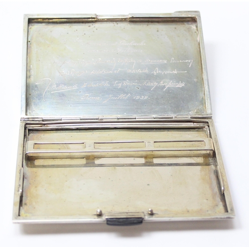 1091 - An Italian 800 silver cigarette case with striped decoration, dedication inside to Adnan Muzahim Ame... 