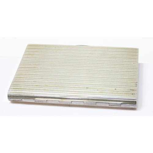 1091 - An Italian 800 silver cigarette case with striped decoration, dedication inside to Adnan Muzahim Ame... 