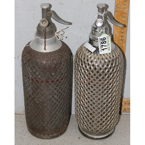 1786 - 2 Art Deco period soda siphon seltzer bottles with wire-mesh covering