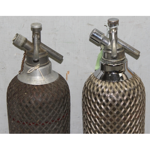 1786 - 2 Art Deco period soda siphon seltzer bottles with wire-mesh covering