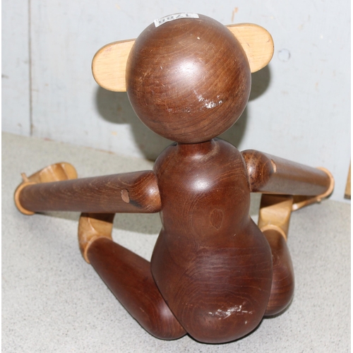 1788 - An unusual carved wooden monkey approx 46cm