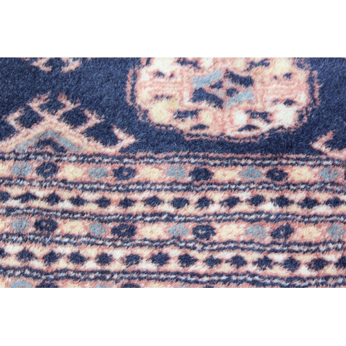 203 - An extremely large and finely woven Bokhara rug of blue and cream ground, approx 430cm x 300cm