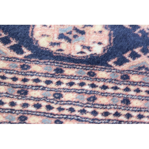 203 - An extremely large and finely woven Bokhara rug of blue and cream ground, approx 430cm x 300cm