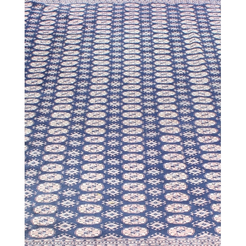 203 - An extremely large and finely woven Bokhara rug of blue and cream ground, approx 430cm x 300cm