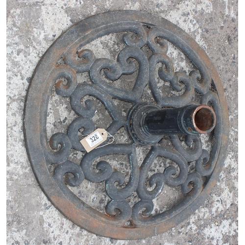 328 - A large cast iron parasol base and 2 garden umbrellas