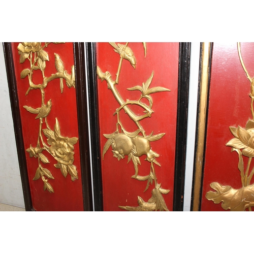 447 - Three Chinese rectangular wooden panels with applied gilt carvings, each panel approx 30cm x 90cm