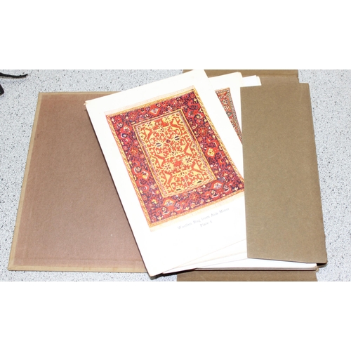 511 - Two 1930’s editions of portfolios of “Masterpieces of Oriental Rugs” containing 120 colour cards dep... 