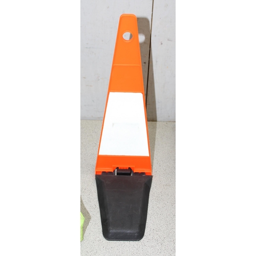 718 - Surveyors measuring wheel in box and a set of 4 fold-out safety cones in carry case