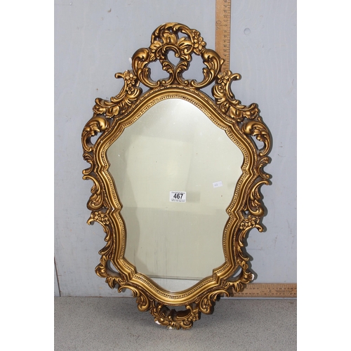 467A - Gilt framed shield shaped wall hanging mirror with classical design approx. 73cm x 42cm