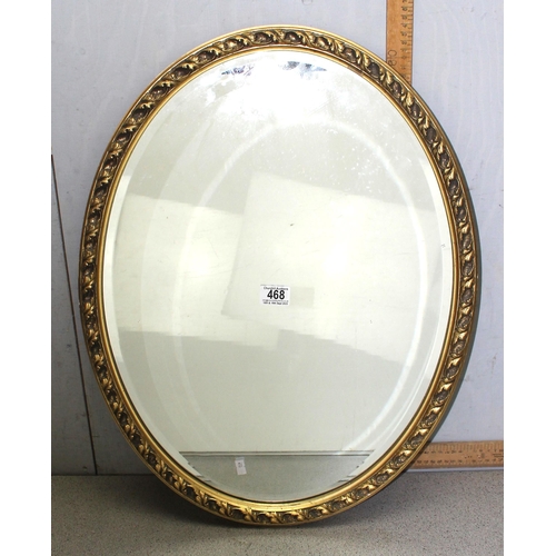 468A - Gilt framed oval wall hanging mirror with bevelled glass and oak leaf border design approx. 64cm x 5... 