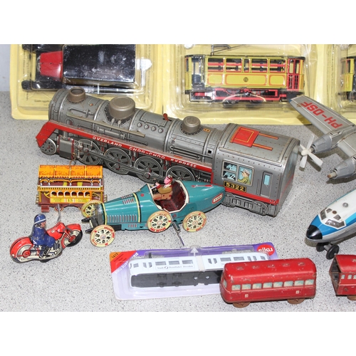 1511 - Qty of boxed and unboxed collectable to vehicles to include a boxed Hudson J3-a Streamliner