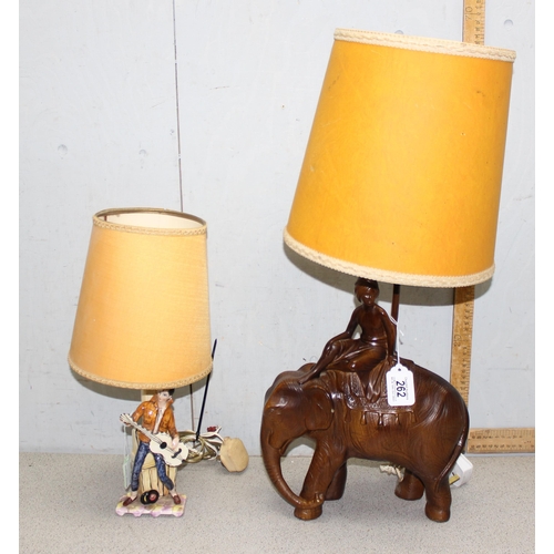 262 - Faux wood pottery lamp of an elephant with a Mahout and an Italian pottery lamps of a lady Elvis (2)