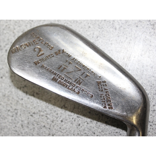 704 - Qty of vintage wooden handled and other golf clubs to include various irons and putters