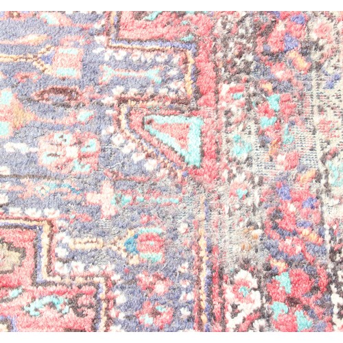 219A - Roll of colourful upholstery material, approx 150cm wide, and woollen hand tied red ground rug appro... 