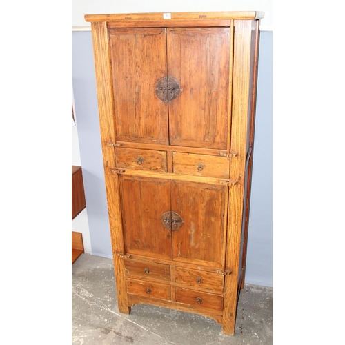 150 - A large Chinese hardwood cabinet, likely Elm with hand wrought iron fittings, likely 19th century, a... 