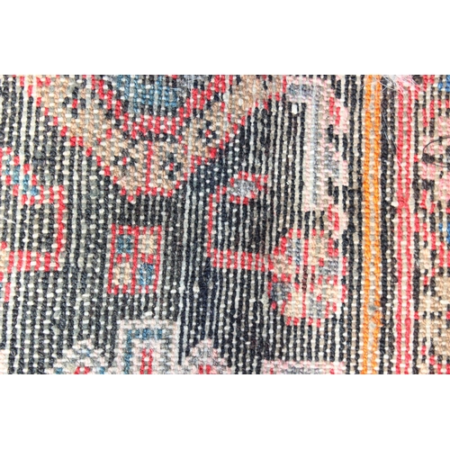 211 - A vintage red ground handmade rug with colourful decoration, possibly Hamadan region, approx 230cm x... 