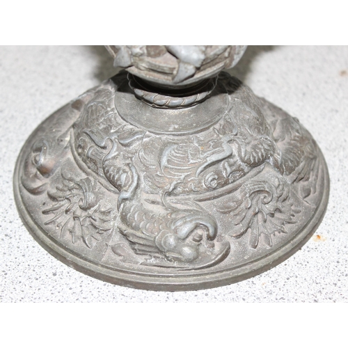 269A - An antique oil lamp, the base cast spelter depicting scenes of either missionaries or slave traders ... 