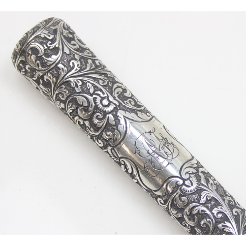 1020A - A large Anglo-Indian silver parasol or umbrella handle with acanthus scrolled decoration, seemingly ... 