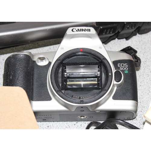 669 - Qty of cameras to include a Canon T70 and an Olympus AZ-300 super zoom