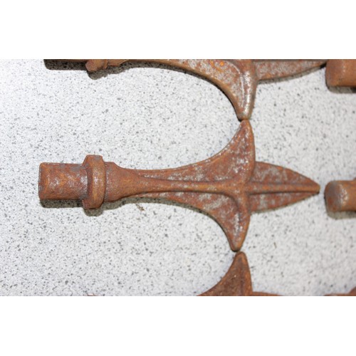 339 - 12 assorted vintage cast iron fence or post finials, each approx 15.5cm tall