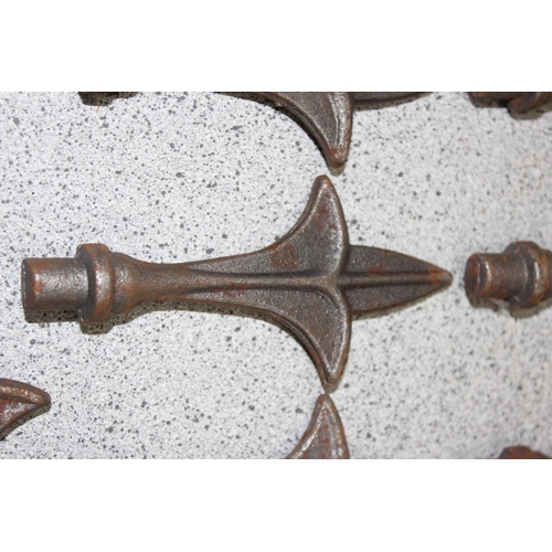 346 - 13 assorted vintage cast iron fence or post finials, each approx 12cm tall, slightly smaller