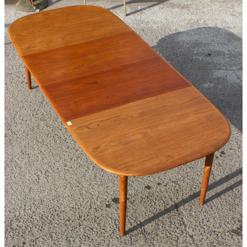 106 - A retro Nissen of Denmark extending dining table and 6 chairs, approx 247cm wide x 108cm deep x 73cm... 