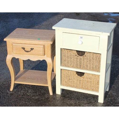 123 - A small white painted pine side table with 2 wicker drawers and a limed oak style bedside table with... 