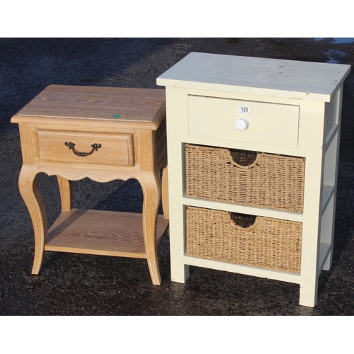 123 - A small white painted pine side table with 2 wicker drawers and a limed oak style bedside table with... 