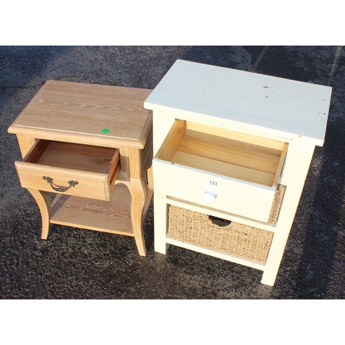 123 - A small white painted pine side table with 2 wicker drawers and a limed oak style bedside table with... 