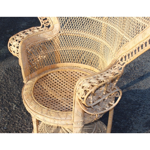 125 - A large vintage wicker peacock chair, approx 109cm wide x 56cm deep x 148cm tall